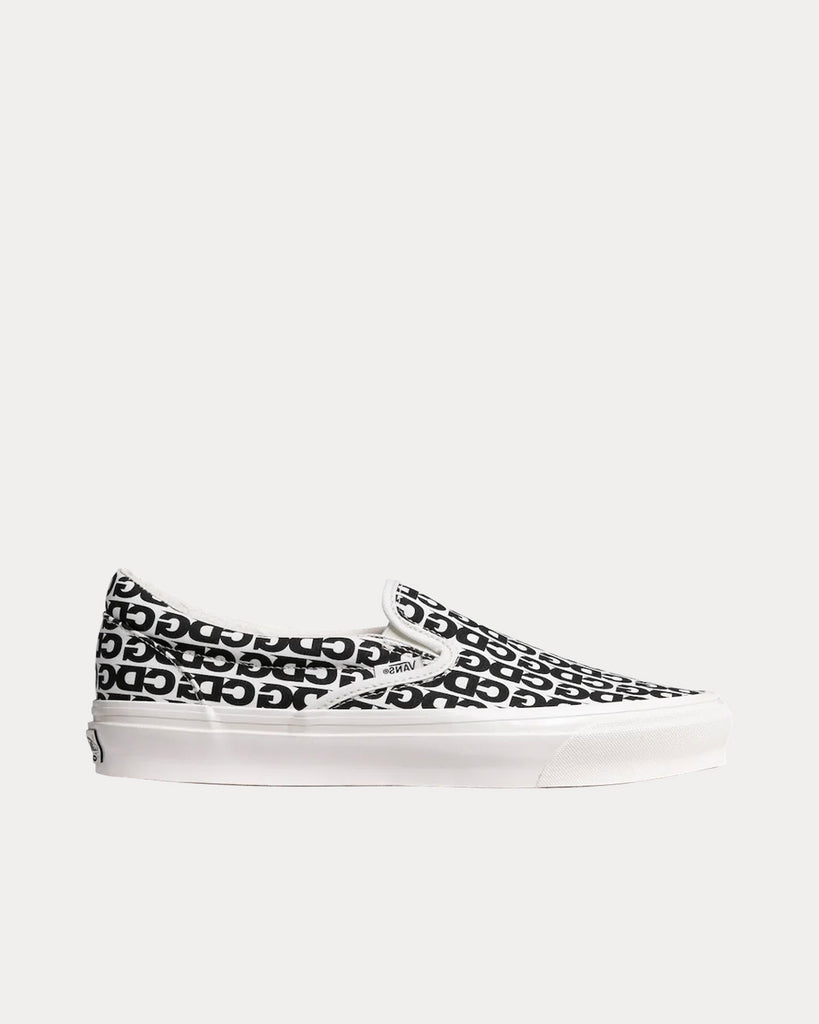 x Vans Black / White Slip Ons