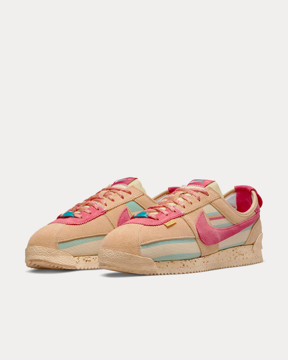 Nike pink with on sale swoosh suede cortez trainers