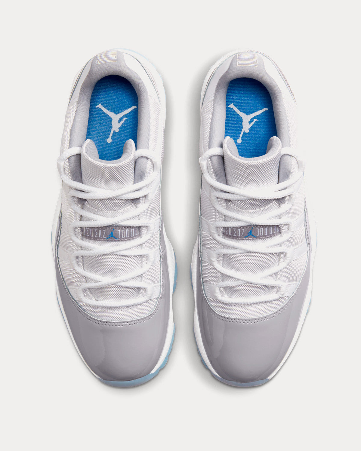 Jordan - Air Jordan 11 Retro Low White / University Blue / Cement Grey Low Top Sneakers
