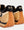 Flow Runner Suede Gold / Black Low Top Sneakers